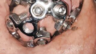 close up of the set screw in my chastity cage