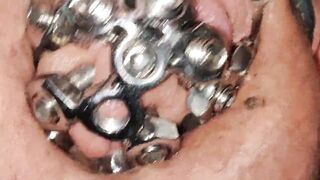 close up of the set screw in my chastity cage
