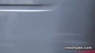 Brunette using a pass way as her own toilet
