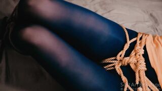Yellow-blue tied legs in nylon stockings