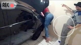 Naughty mechanic attending to madam with her broken car alone in the workshop!