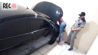 Naughty mechanic attending to madam with her broken car alone in the workshop!