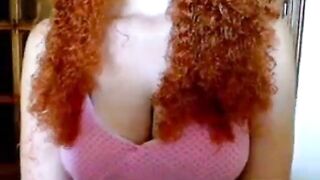 busty readhead with curly hair