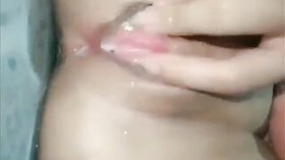 Pinay fingering her wet pussy in the shower
