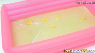 Asian babes pee in paddling pool