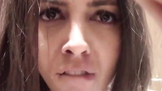 Brunette makes a selfie in the store changing rooms