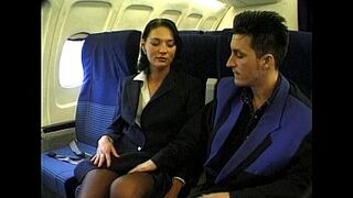 Brunette beauty wearing stewardess uniform gets fucked on a plane