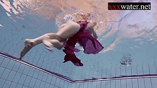Smoking hot Russian redhead in the pool