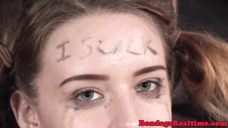 Femdom rubs pussyjuice on suspended teen