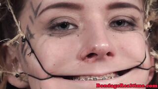 Femdom rubs pussyjuice on suspended teen