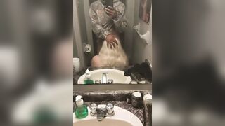 Mirror blowjob in the bathroom