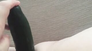 Carol playing with a cucumber