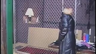 Leather-clad dominatrixes restrain and punish male slave in BDSM chamber
