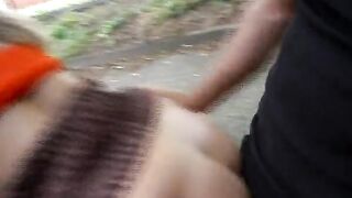 A busty German chick pleasing two dudes in public