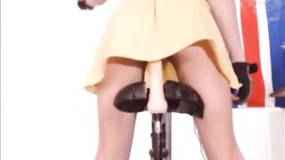 Teen riding dildo on bike