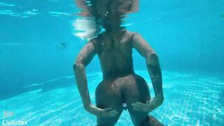 Showing off my buttplug in my friends pool