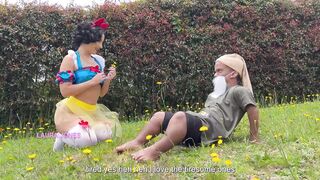 Laura Jones as Snow White steals milk from a careless dwarf