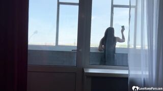 Cock sucking on a balcony