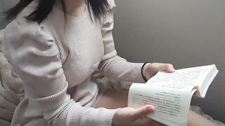 A cute girl reading in the morning