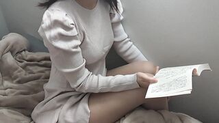 A cute girl reading in the morning