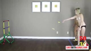 Two beautiful ladies strip while playing toss the balls