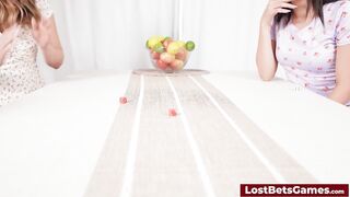 Lesbian couple stripping down and playing on the bed
