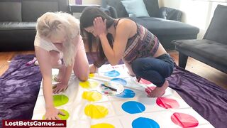 Strip twister enjoyed by two sexy lesbians
