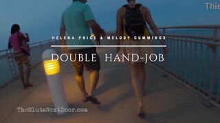 Double handjob on public beach