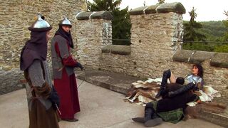 Porn video in a castle with a brunette woman and three men