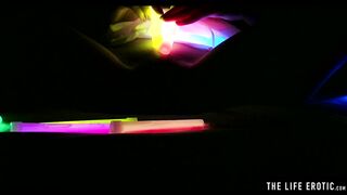 Watch this hot blonde plunge glowsticks in her pussy and ass