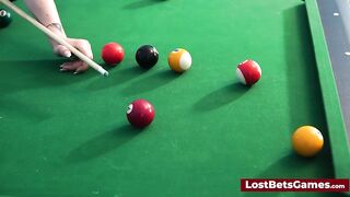 A big tits lesbian couple playing billiard and using the stick in a new way