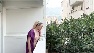 Blonde beauty naked on the balcony