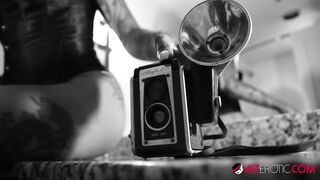 Beautiful tattooed ebony babe rubs her hairy pussy