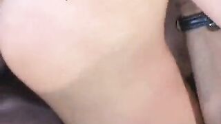 Black guy in sunglasses drills sexy young brunette on couch