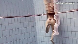 Sexy underwater teen swimming