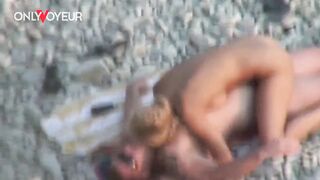Beach Voyeur. Gorgeous blonde babe riding her man on a public beach