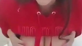 Leggy busty takes off her sports bra