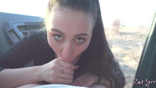 Black Lynn sucks cock in a car at sunset