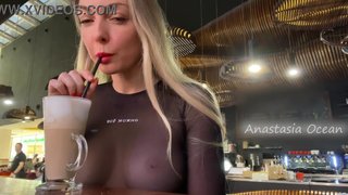 Public - Sexy blonde flashes her big natural tits in a crowded cafe.