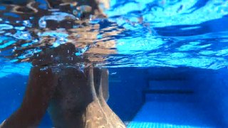 AN EXUBERANT MILF PENETRATED UNDERWATER