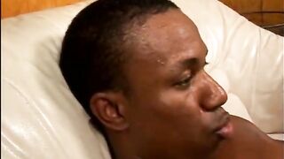 Black couple have passionate sex on couch