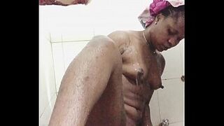 African girl with shower and finger herself, squirting and moaning