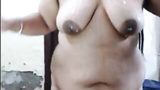 Indian aunty spitting saliva all over her body