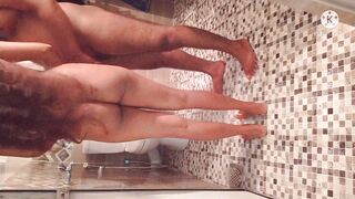Husband and wife bathing on a hot evening.