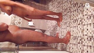 Husband and wife bathing on a hot evening.