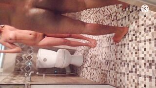 Husband and wife bathing on a hot evening.