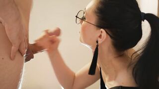 Bespectacled stepmother takes the pecker of her lascivious stepson in her mouth.