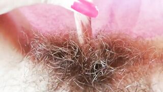Extremely hairy pussy with big lips close-up