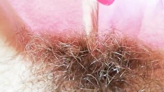 Extremely hairy pussy with big lips close-up
