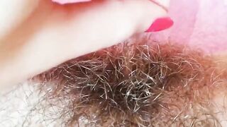 Extremely hairy pussy with big lips close-up